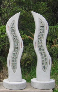 A river reaching towards the sky represented by elemental inlays, shadow lines on three sides and also negative airspace between the pair. Inset curved copper denotes the headlands that shape the rivers path 